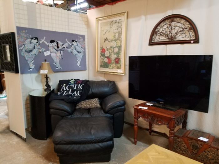 All you need for a top drawer media room... comfy leather media chairs (4), large flat screen TV, large black leather sectional with matching chair/ottoman (shown).