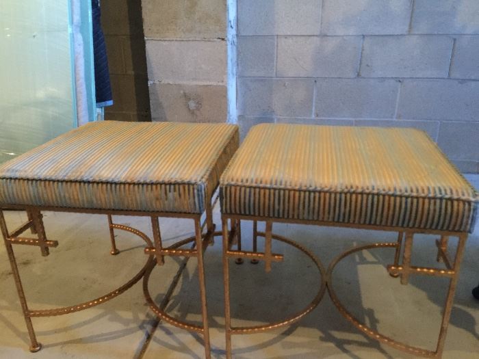 Two designer metal benches with custom upholstery. 
