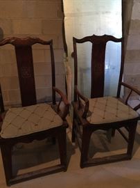 Antique wood chairs with custom pads. Sold as a pair.