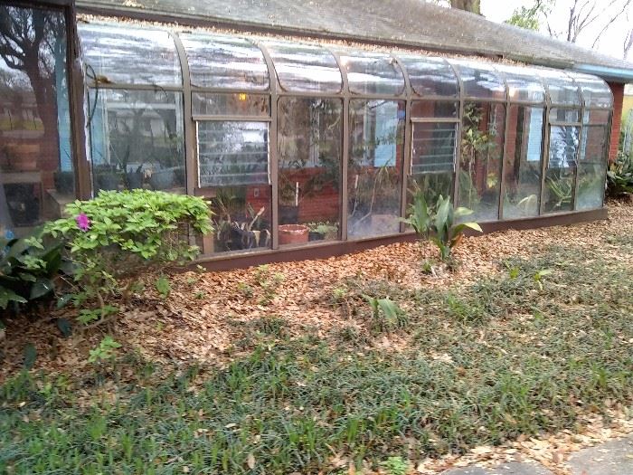 Awesome greenhouse shown here attached to the home