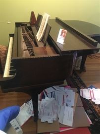 Emerson Boston baby grand piano.