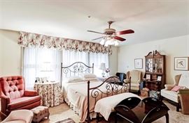 Tons of well kept furniture throughout the home