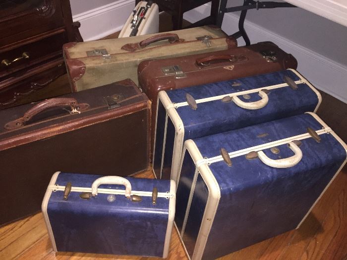 over a dozen vintage suitcases--Lady sewed and she kept her sewing supplies in these cases