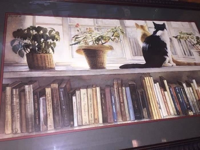 precious framed print of cat on a bookshelf