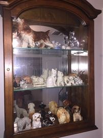 wall hung display cabinet with ceramic cat and dog collection