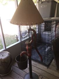 fantastic working floor  lamp made out of a FULL size water pump with original bucket
