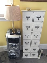 Stereo and small file cabinet.