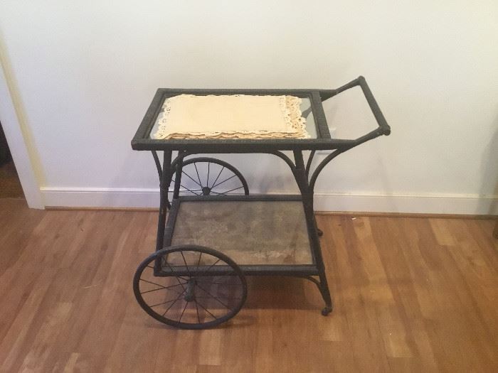 Wicker and Glass Tea Table with Lace Placemats  https://www.ctbids.com/#!/description/share/7710
