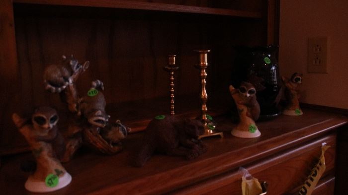 Assorted brass candlesticks, raccoon figurine and framed print collection
