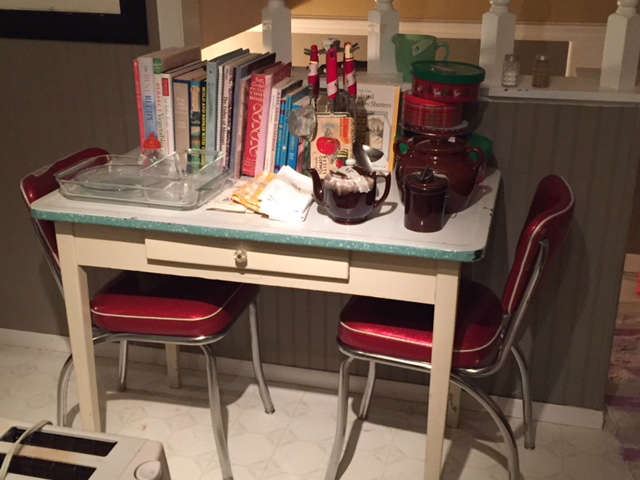 Porcelain top table, retro red chairs, crockery, books