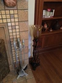 Fireplace tools and one of two large candle holders