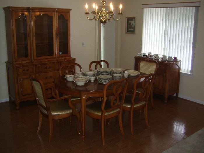  11 piece dining set. China cabinet is two piece. Table has a 12" leaf.