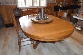 Large oak round table with two leaves--will seat 10, selling chairs separately -- all unmatched