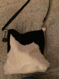 Cowhide hair on skin with leather back and repurposed strap.  14x16 inch messenger bag. $95