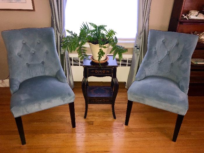 Microsuede chairs with stenciled occasional table.