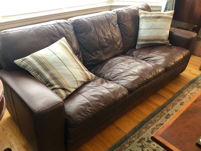 Brown leather style sofa in very nice condition
