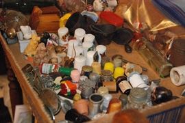 Collection of thimbles, mini salt and pepper shakers, mini cast iron and other mini collectibles.
