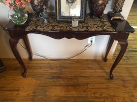 only the table is for sale, not any items on top of it.