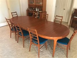 Mid century modern 9 piece Danish made dinning room table with protective pads.