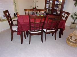 Klaussner dining room table with 6 chairs(2 are captain) 2 drawers, leaf and pad/table protector and matching china cabinet- Contemporary look