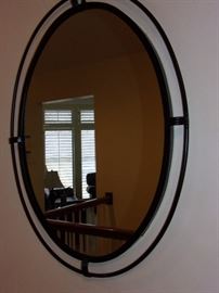 Oval mirror with metal accent frame