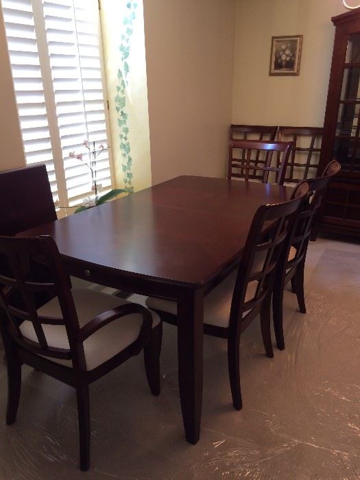 Klaussner dining room table with 6 chairs(2 are captain) 2 drawers, leaf and pad/table protector and matching china cabinet- Contemporary look