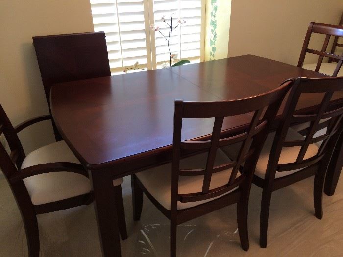Klaussner dining room table with 6 chairs(2 are captain) 2 drawers, leaf and pad/table protector and matching china cabinet- Contemporary look
