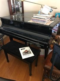 1995 black lacquer Wurlitzer baby grand piano model G-457; includes bench and piano lamp - $3000.