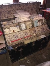 Gorgeous antique trunk. Vintage baby clothing