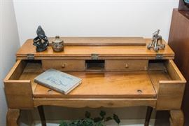 Antique Carved Stone Figure (6"):  $90.00  Weed Pot:  $7.50  Cast Brass Elephant and Figurine On Wheels:  $39.00  Book by Osborne 1962.  "How to Deal w/ Parents and Other Problems:  $27.00