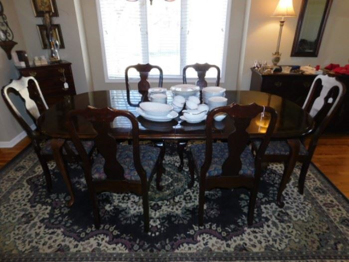 Side view of dining table, Castello Area Rug 7x 10 