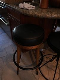 2 wood and black leather stools
