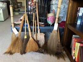 collection of handmade brooms