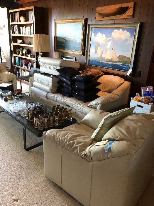 White leather sofa - (Sold) and 2 chairs, slate and iron coffee table - 2 side tables - Ship painting on the left has sold.  Loads of barwear and nautical items
