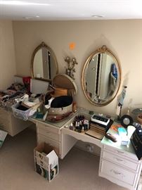 Pair of Oval Gilded mirrors - hats, scarves, loads of makeup, products, jewelry boxes, costume jewelry