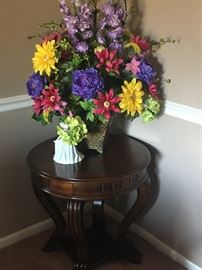 Silk arrangement and round wood end table