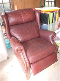 Burgundy leather recliner with studs