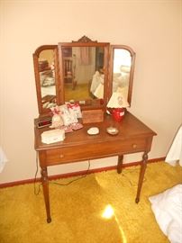 Small antique dressing table with attached mirror