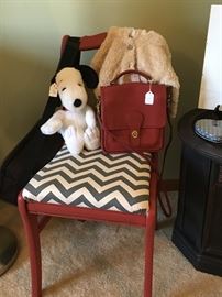 Fun and funky side chair with Coach purse and Snoopy overseeing it.