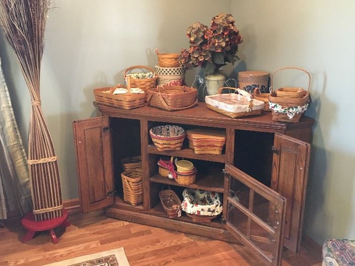 More Longaberger baskets displayed in nice corner cabinet