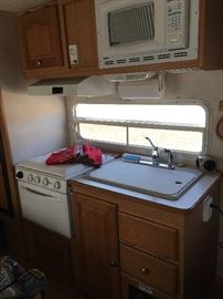 Kitchen area and microwave in the camper