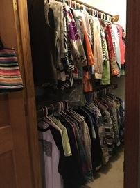 Closet packed full with ladies clothing