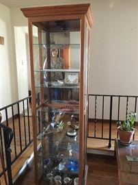 Oak curio cabinets; 2 available