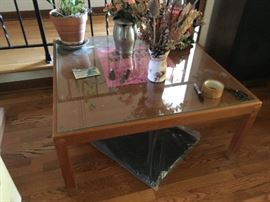Square coffee table with glass top
