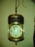 MICHELOB HANGING LIGHT WITH ROTATING CLOCK INSIDE - The clock inside the light rotates and appears to keep correct time. Very nice piece. 23" H X 13" W and 8ft. chain