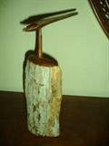 ORIGINAL SANDLEWOOD CARVING BY MOZAMBIQUE ARTIST MABANDA,(born Jose Rodrigues Fumo). Mabanda carves statues from wood leaving the front of the statues in its rough-hewn state and polishes the back to a lustrous patina. This 2 piece statue is gorgeous and unusual. This piece of sandlewood has been carved to a sharp point on top and a separately carved bird is made to sit on top the point.