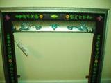 ANTIQUE CAST IRON FIREPLACE FRAME WITH RAISED SCROLL & FLOWER DESIGN