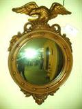 BULLSEYE MIRROR IN ROUND HEAVY PLASTIC FRAME WITH EAGLE ON TOP -

Dimensions: 29" X 18"