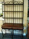 METAL AND WOOD BAKERS RACK - Wicker accent with wood shelf in center & 3 shelves on top rack have glass insets. Made to used with or without top rack. It is a very nice hall or console table with the top rack.