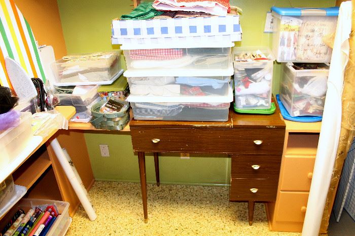 Vintage sewing desk, bins of fabric, sewing patterns, and more!